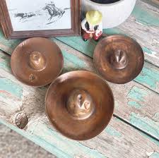 Vintage copper cowboy hats – www.rawhidenrosesboutique.com