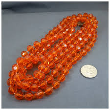 Vintage Sixty Inch Long Orange Acrylic Beaded Necklace, 1960s. For Sale at Ruby Lane
