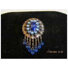 1920" Deco brass and crystal dangle brooch in blue - Ruby Lane