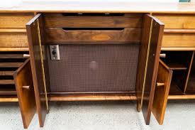 Lot - SAM MALOOF (1916 - 2009): THREE-PIECE WALNUT BUFFET