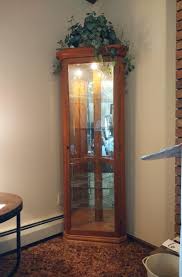 CURIO CABINET W/3 GLASS SIDES AND MIRRORED BACK, 3 GLASS SHELVES | EstateSales.org