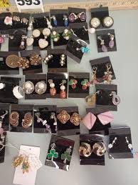 Sold at Auction: Box of costume earrings