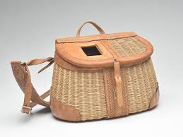 Sold at Auction: Woven side hole fishing creel with tooled leather, George Lawrence.