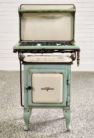 Sold at Auction: Cast iron enamelled 'Early Kooka' stove by Metters (138 x 68 x 54cm)
