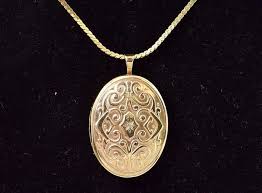 Meaningful 14K Yellow Gold Locket Pendant Necklace - U.S. Auction Brokers