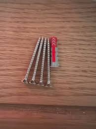 Can someone explain this to me? Screws and plugs for my String shelf : r/DIYUK