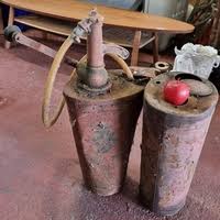 A lovely Mi-century style coffee table with a long oval top and a second rattan tier. Approx 5 feet
