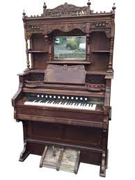 Sold at Auction: A Victorian walnut cased harmonium with Crane & Rose Ltd, Liverpool retail label, the back foliate c