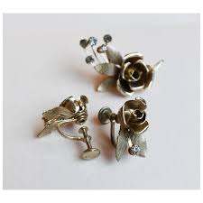 Vintage crystal flower brooch and clip on earrings set. For ...