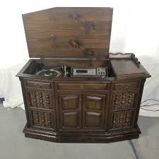 Lot 32 ~ 1950 - 1960 Sylvania record player/8-track tape/ radio console cabinet. | EstateSales.org