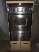 2 VINTAGE KITCHEN CABINET sets: 1 (Montgomery Ward $650 and ...