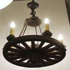 1940s Wood and Wrought Iron Five-Light Wagon Wheel Chandelier For Sale at 1stDibs | wrought iron wagon wheel chandelier, wagon wheel chandelier with shades, vintage wagon wheel light fixture