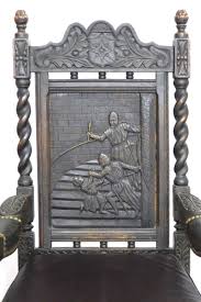 Lot - Pair of Jacobean Revival arm chairs with carved genre ...