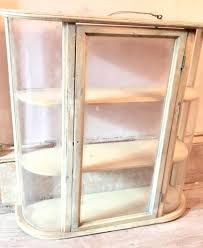 Vintage Wall Hanging Cabinet Curved Glass | EstateSales.org