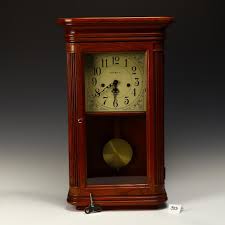 Sold at Auction: Howard Miller Oak Case Westmister Clock