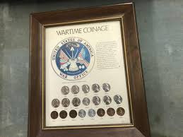 Sold at Auction: 20 PIECE WARTIME COIN COLLECTION IN FRAME