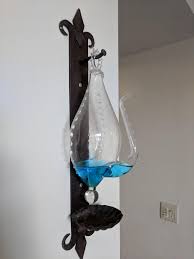 Hung on the Wall, Has a Spout, and Filled with Blue Liquid ...