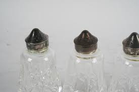 Lot - FOUR WATERFORD CRYSTAL CASTERS / SHAKERS