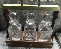 Antique Decanter Tantalus WITH 3 CRYSTAL DECANTERS | eBay