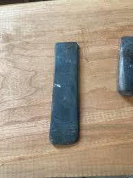 Can't I get some help please. I dug these 2 pieces out today. Is this Cannel Coal or Slate ? Is it a broken pendant or gorget? What are the scoring lines.