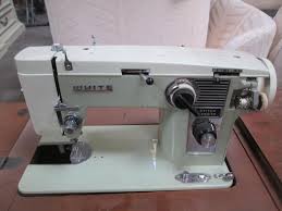 Sold at Auction: 1950's White Sewing Machine In Cabinet