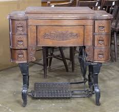 Vintage White Sewing Machine, Resting On Cabinet