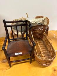 Sold at Auction: Vintage dolls furniture inc turned spindle back arm chair, cane arm chairs, parasol and cane bassinet. Spindle back chair is 33cm H.
