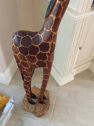 Sold at Auction: WOOD GIRAFFE STATUE