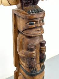 Sold at Auction: CARVED WOOD FIGURAL TOTEM POLE SCULPTURE. CARVED BIRD WITH SPREAD WINGS, HUMAN FIGURES, ETC. POLYCHR