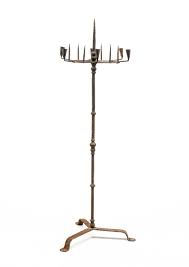Lot - FLOOR-STANDING FORGED IRON PRICKET AND SOCKET CANDLESTAND.
