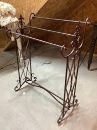 Sold at Auction: Iron Quilt Rack and Coverlets