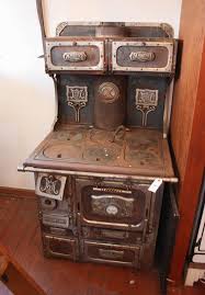 Lot - CAST IRON 'MONARCH' COOK STOVE