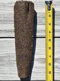 Iron object dug up from yard, with two edges, flat ends, and a through slot : r/whatisthisthing