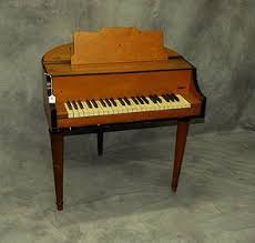 Wurlitzer Student Butterfly Piano. H: 30" W: 30" D: 29"