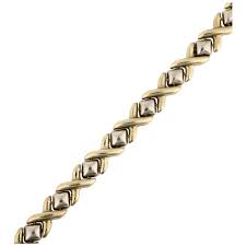 A late 20th century 9ct gold XO link chain bracelet, maker ...