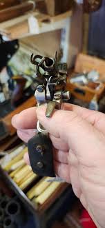 This tool.. Maybe some sort of sewing? It has a leather ...