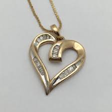 Sold at Auction: 14k Gold And Diamond Heart Pendant Necklace