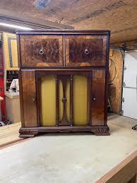 Repurposed antique phonograph with wine storage
